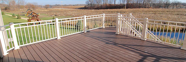 A deck with an aluminum railing style from Two Teacher Construction